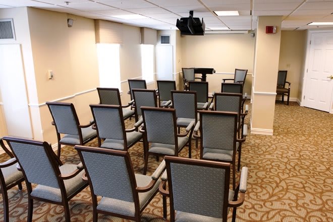 A small conference room arranged with chairs for a meeting or presentation.