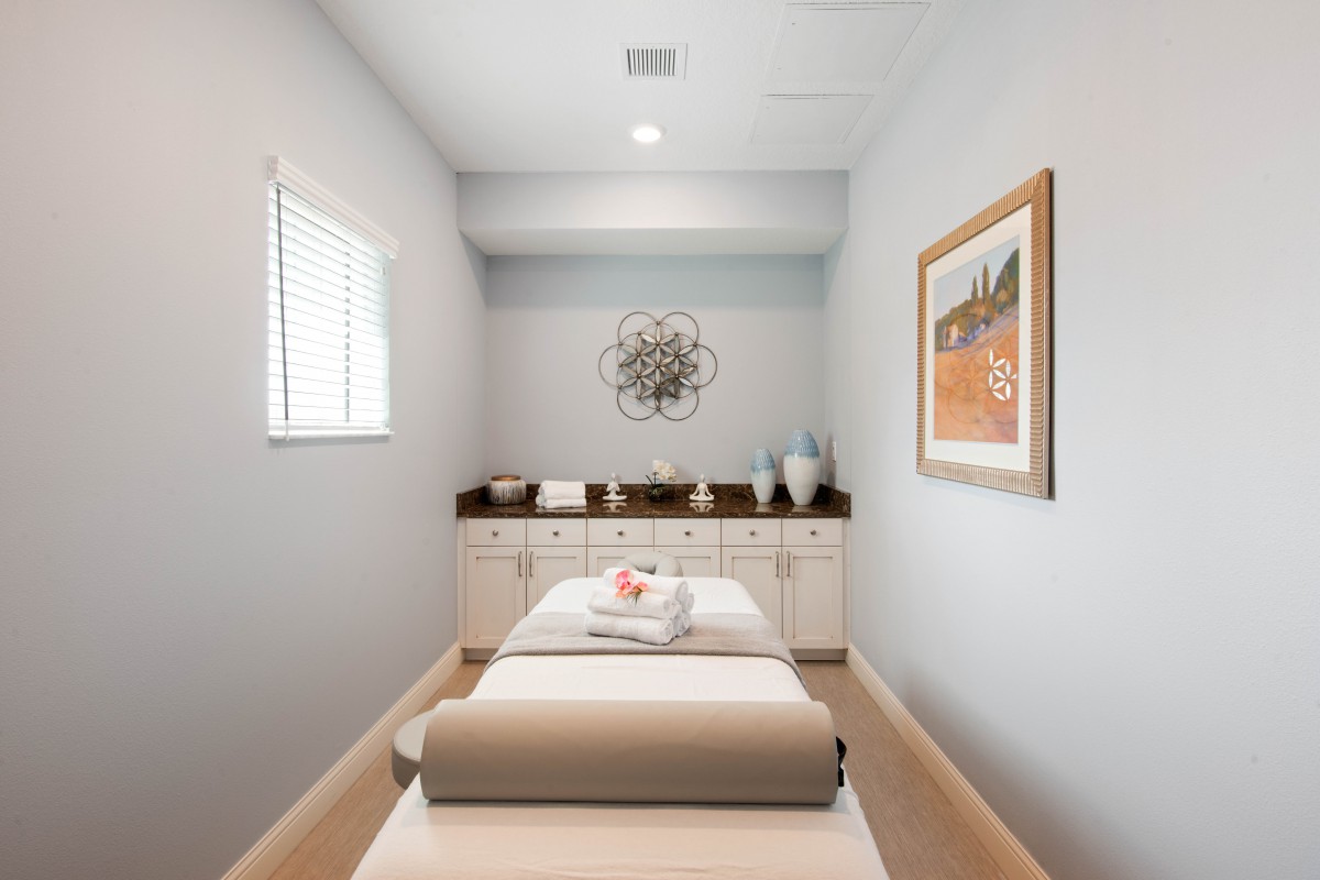 A serene and well-organized massage room, perfect for relaxation and wellness.