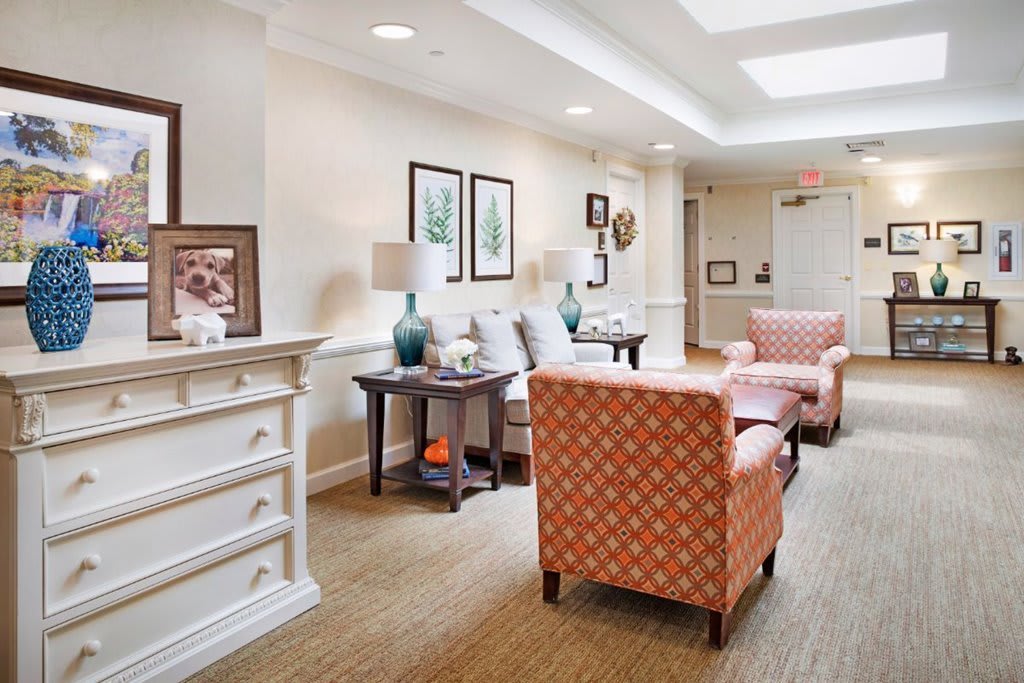 A cozy living room with comfortable seating and decorative elements.