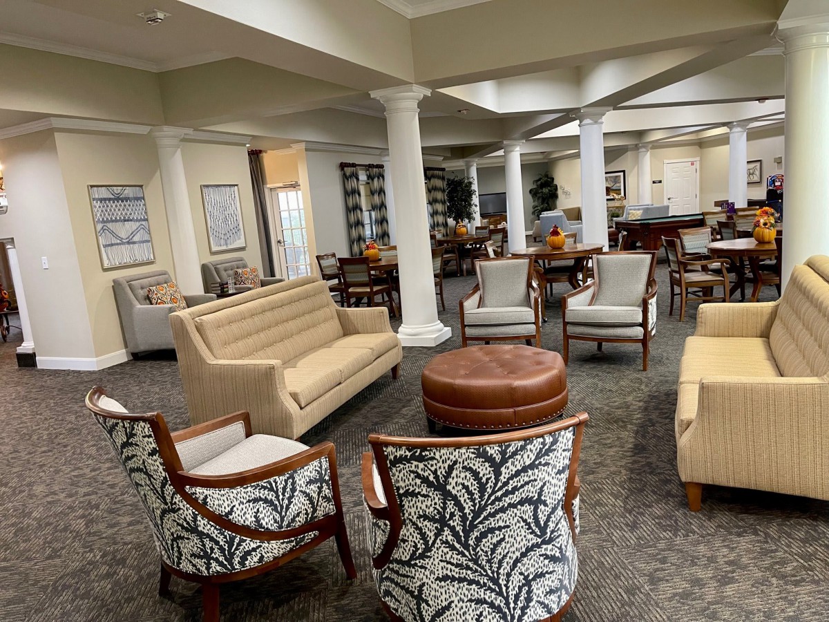 A modern and cozy lounge area with comfortable seating and elegant decor.