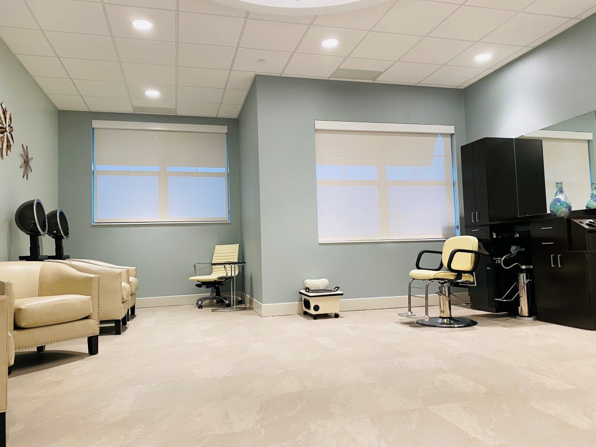 A modern and minimalist waiting room with comfortable seating.