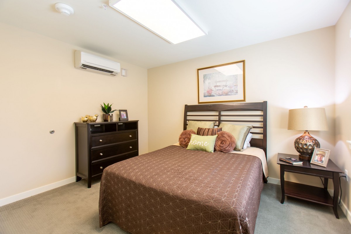 A cozy, modern bedroom with a large bed and stylish decor.