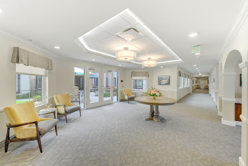 A bright and inviting lobby area featuring comfortable seating and modern lighting fixtures.
