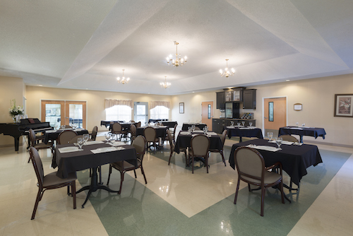 A well-lit dining or conference room set up for an event.