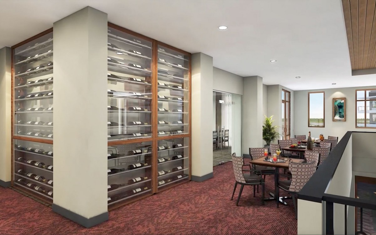 A modern dining area featuring a large wine rack and stylish seating.