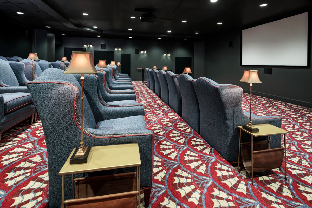A luxurious cinema with comfortable seating and stylish decor.