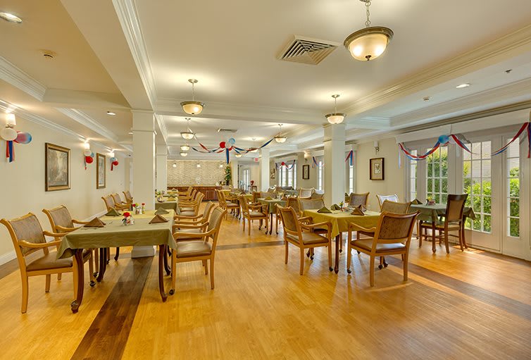 An elegantly decorated restaurant interior with neatly arranged tables and chairs.
