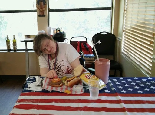 Enjoying a casual lunch with snacks on a festive table.