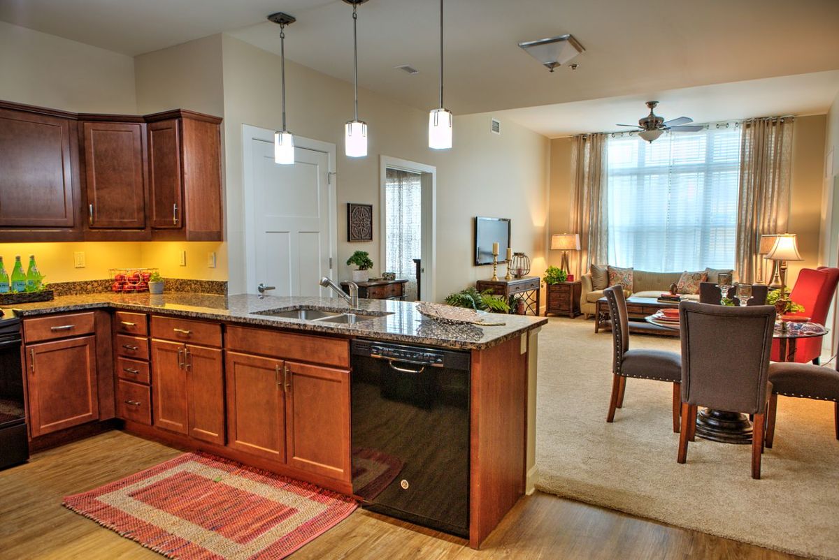 Modern open-concept kitchen with an island counter and adjacent dining area.