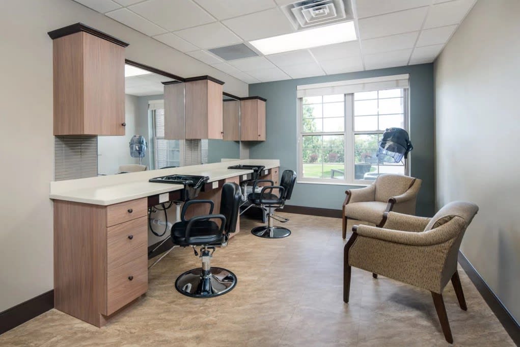 A well-lit hair salon interior with styling chairs and mirrors.