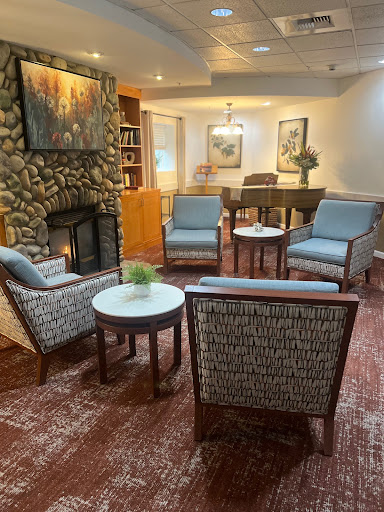 A cozy living room setting with comfortable chairs and a fireplace.