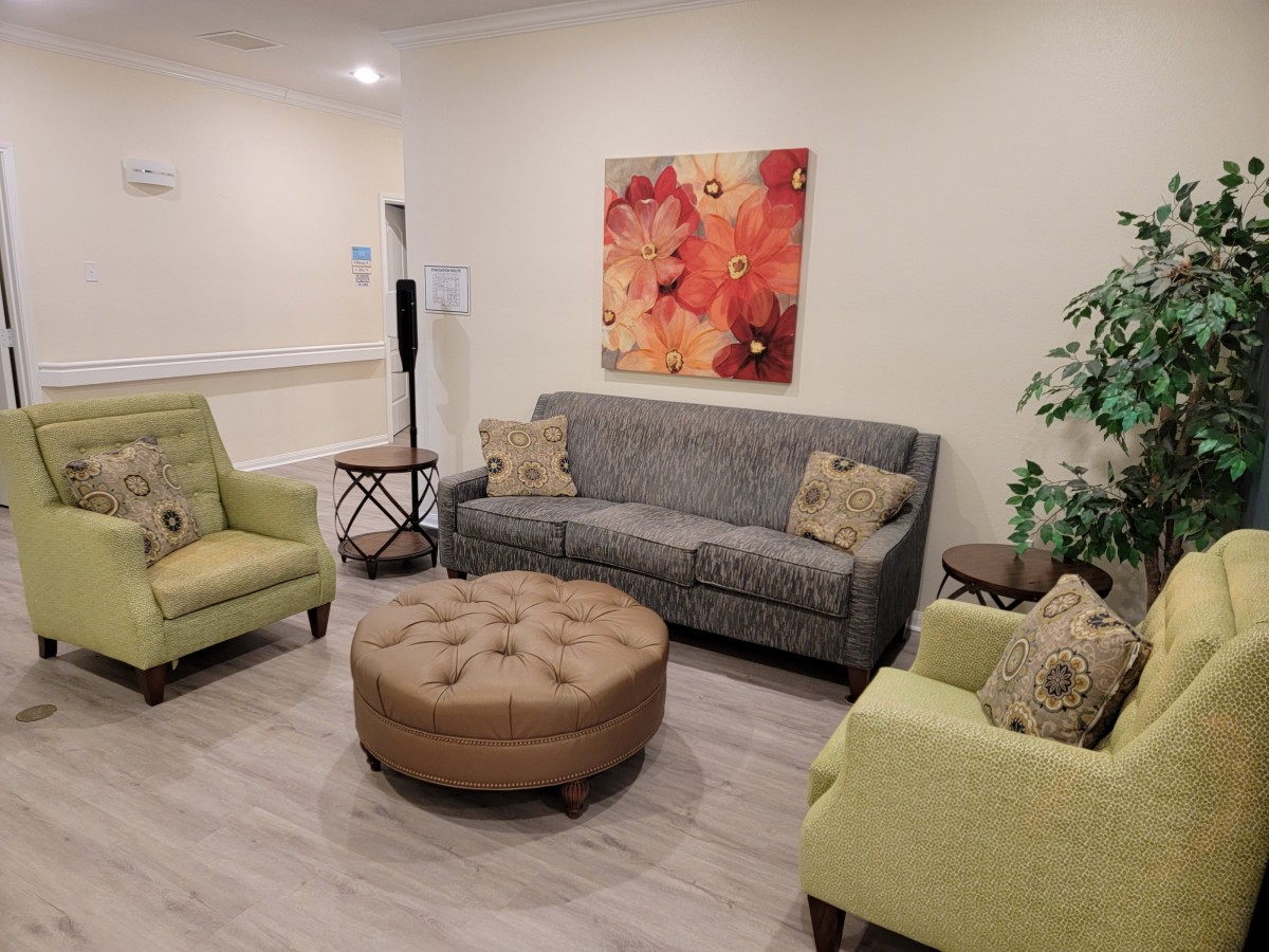 A cozy living room with comfortable seating and a warm decor.