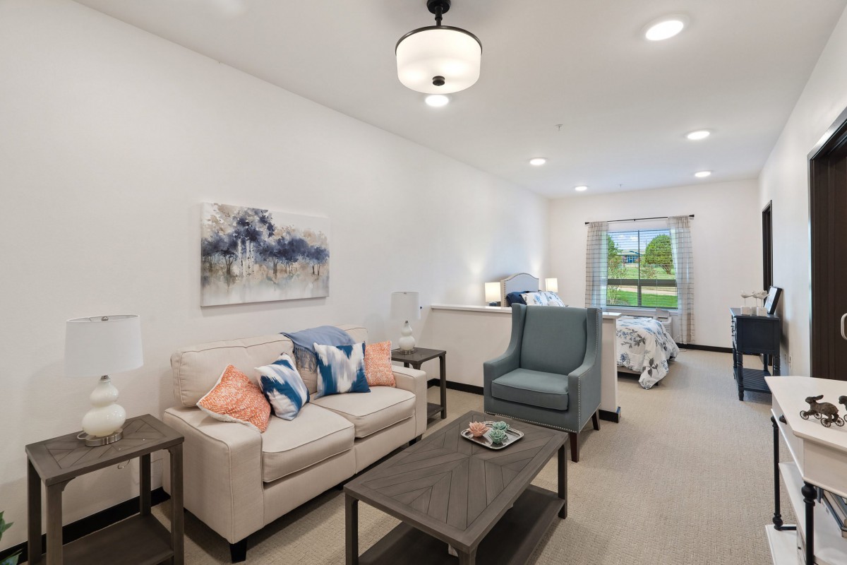 A modern living room with cozy furniture and elegant decor.