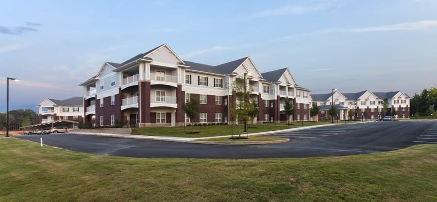 A multi-story apartment building with an elegant design.