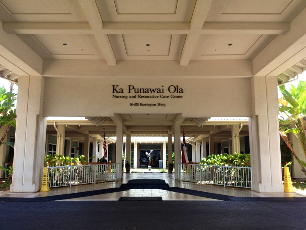 Main entrance of a resort with columns and welcoming architecture.