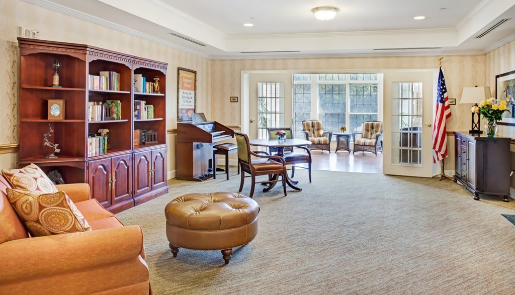 A cozy living room with elegant furniture and ample natural light.