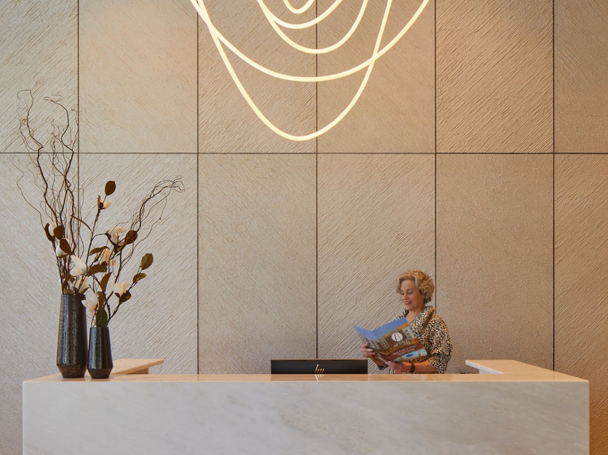 A modern reception area with elegant lighting and floral arrangements.