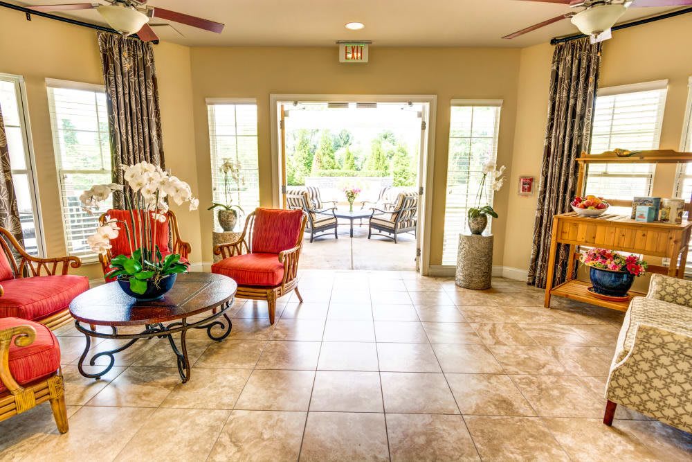 A bright and welcoming lobby area with comfortable seating and natural light streaming through large windows.