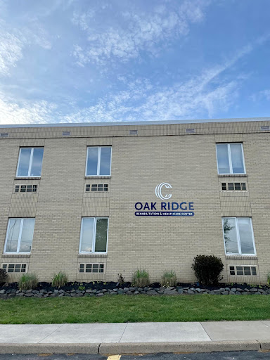 The exterior view of the Oak Ridge building with clear skies above.