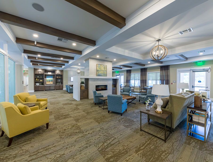 A spacious and modern lounge area with comfortable seating and stylish lighting fixtures.