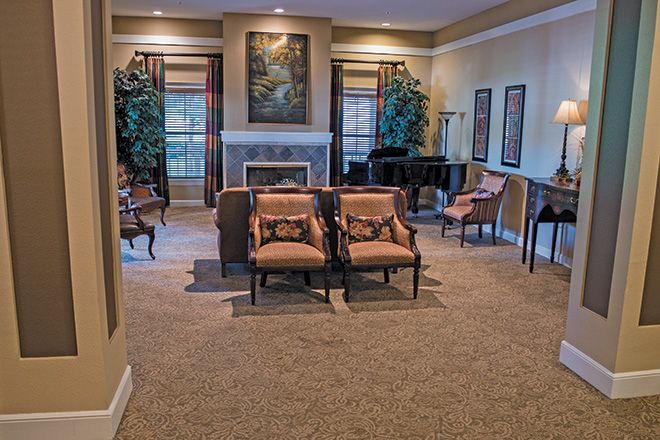 A cozy living room with elegant furniture and a fireplace.