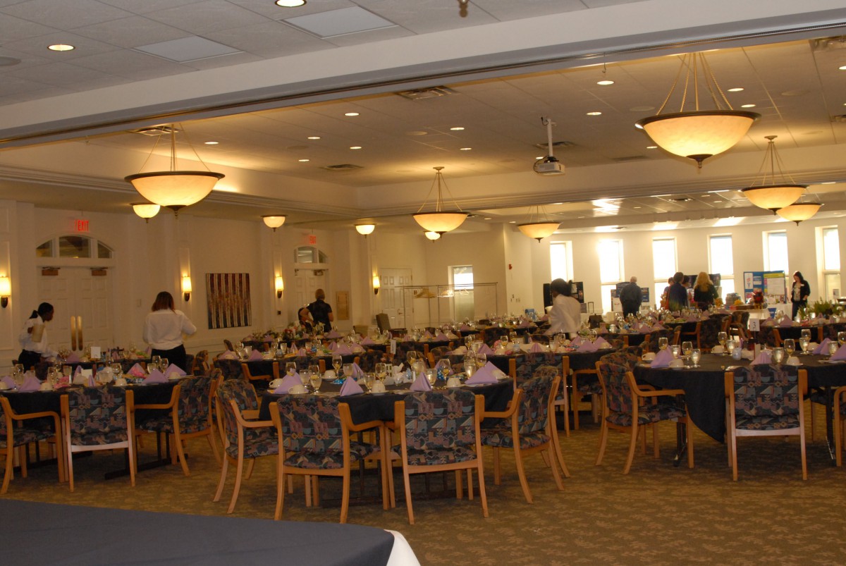 A banquet hall with tables and chairs arranged for an event.