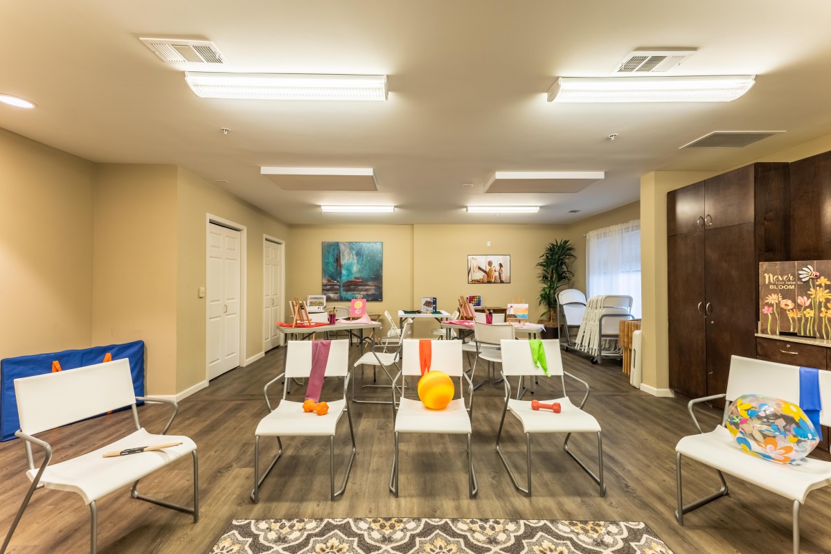A modern waiting area with neatly arranged chairs and colorful accents.