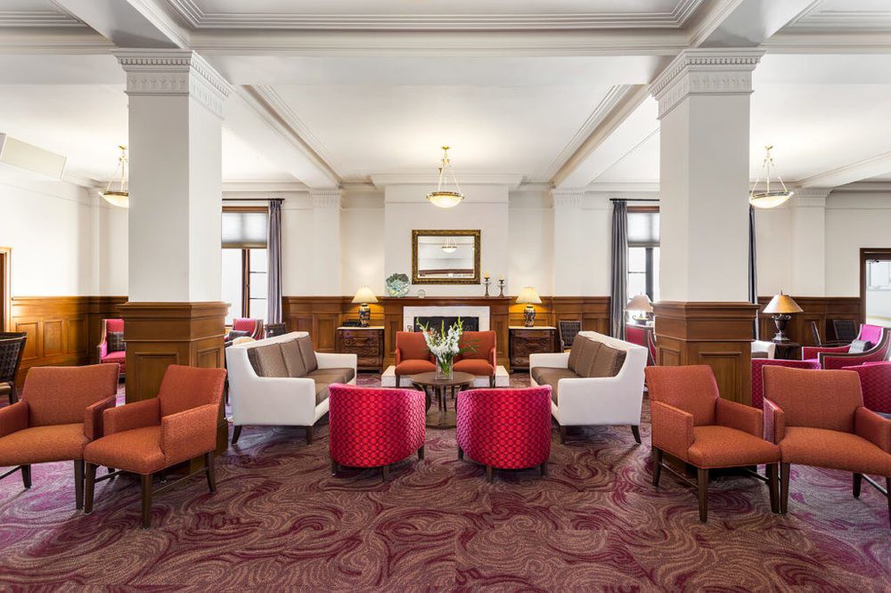 A stylish hotel lobby with comfortable seating and elegant decor.