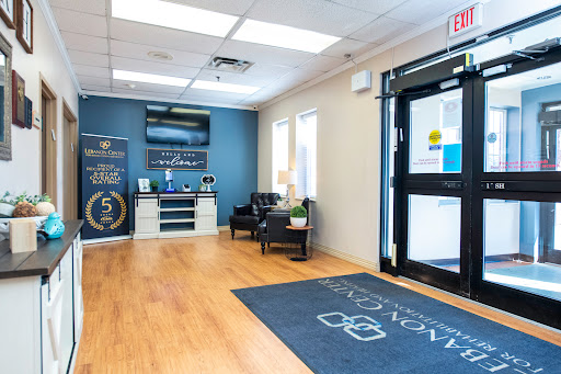 A modern office lobby featuring comfortable seating and a welcoming atmosphere.
