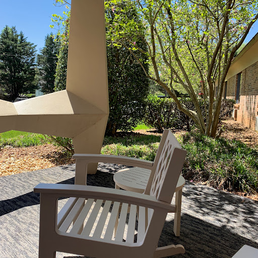 A serene patio scene, perfect for relaxation in the sunshine.