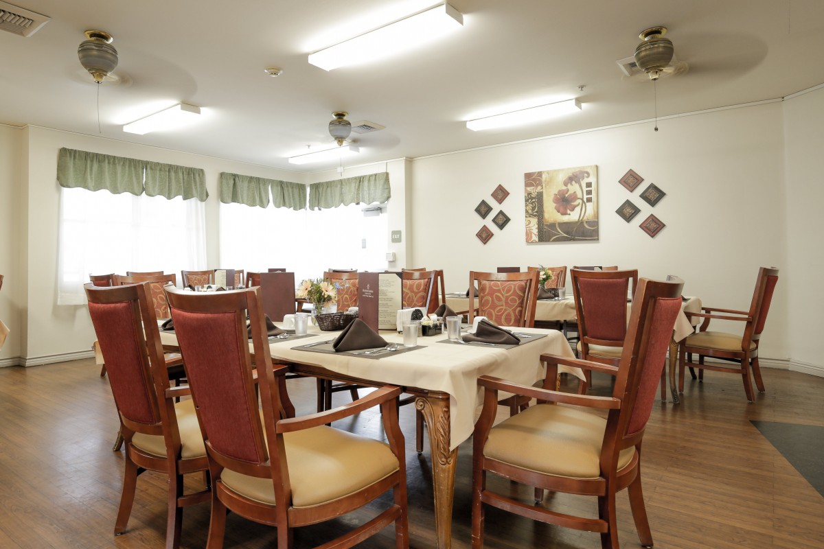 A cozy dining area with set tables and elegant decor.