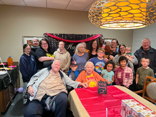 A joyful gathering of family and friends celebrating a special occasion together.