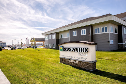 The exterior view of a modern facility with well-maintained landscaping.