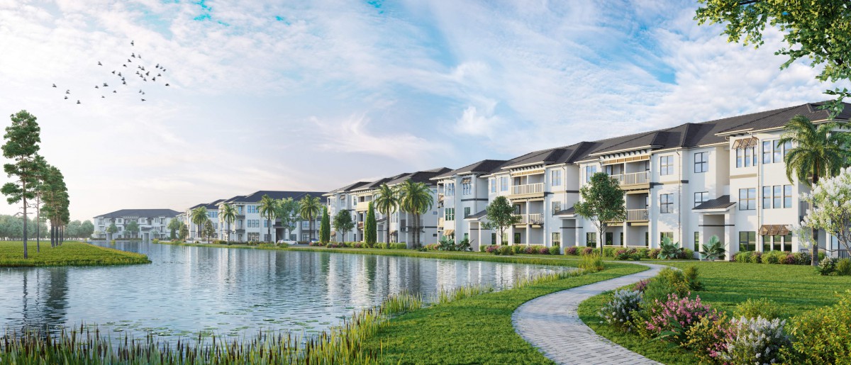 A serene residential area with modern apartments overlooking a lake and a scenic pathway.
