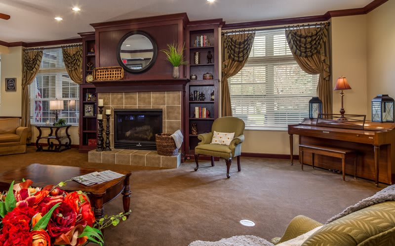 Cozy living room with a fireplace and elegant decor.