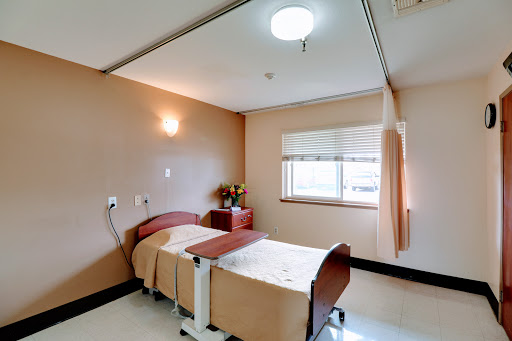 A clean and organized patient room in a healthcare facility.