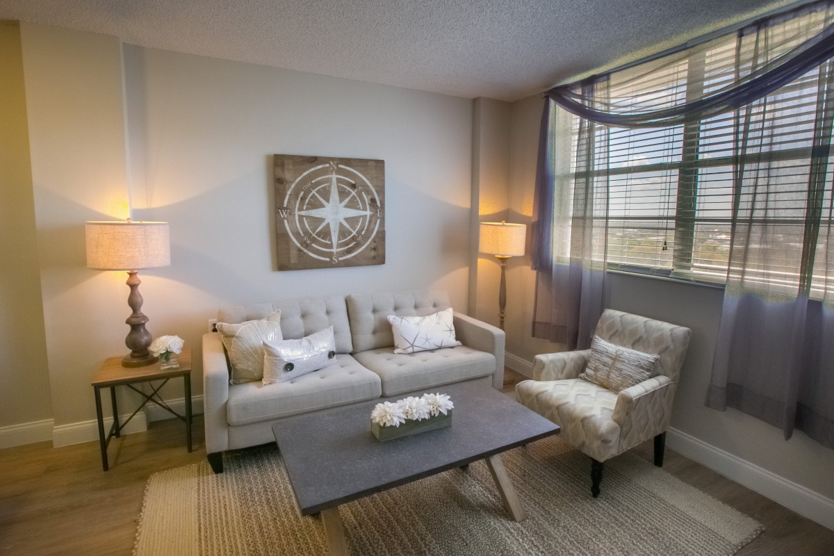 A cozy living room with modern decor and neutral tones.
