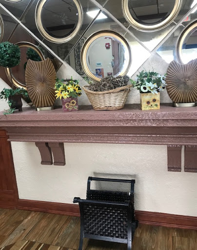 A beautifully arranged shelf with decorative items and mirrors.