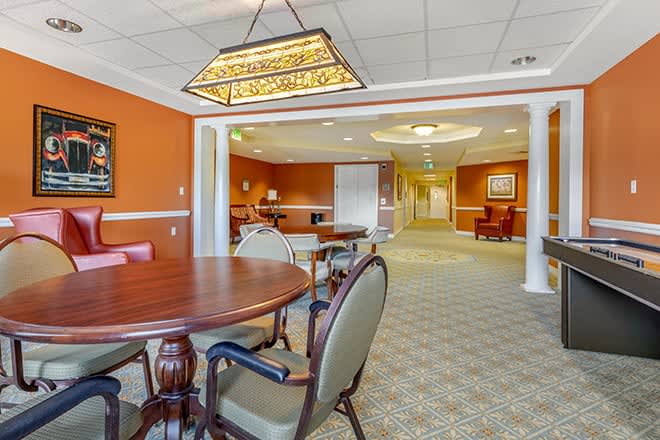 A cozy dining area with elegant seating and warm lighting.