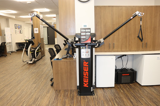 A Keiser strength training machine designed for rehabilitation and fitness.