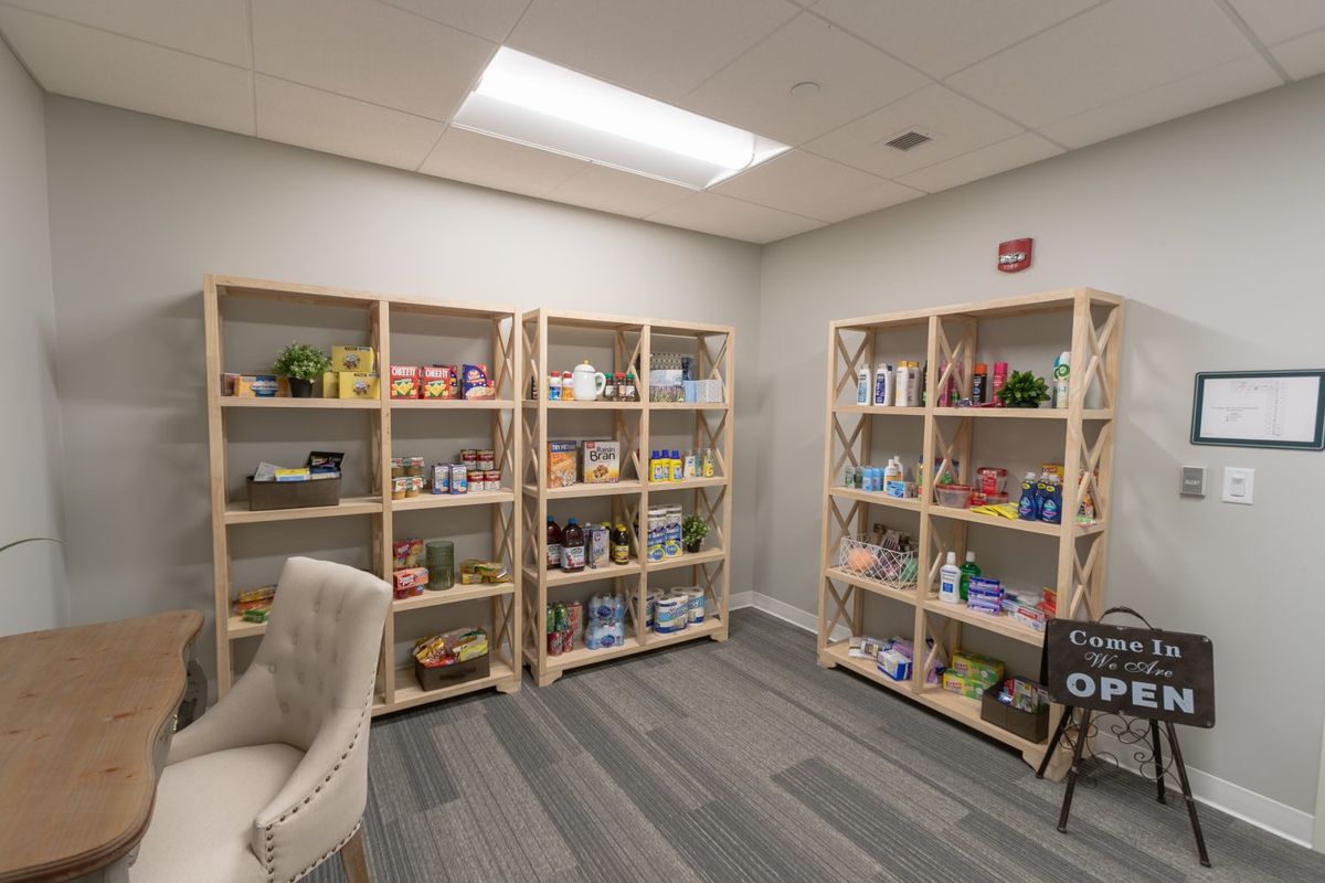 A well-organized office space with shelves displaying a variety of products.