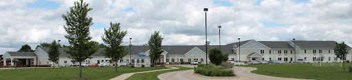 A view of a residential building on a cloudy day.