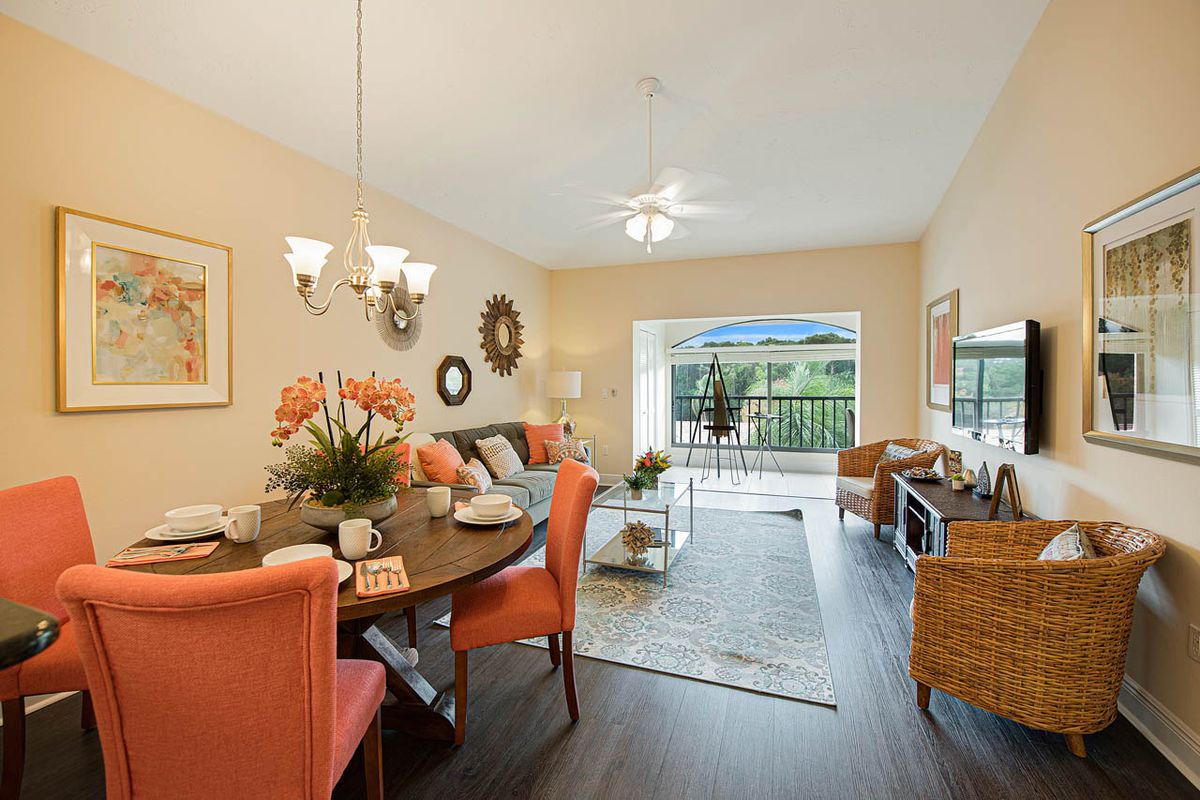 A cozy living and dining area with elegant decor and warm lighting.