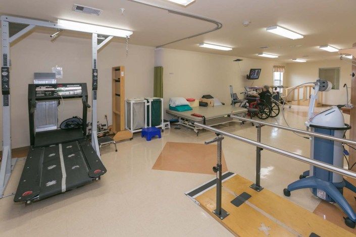 A rehabilitation center equipped with various exercise tools and facilities for physical therapy.