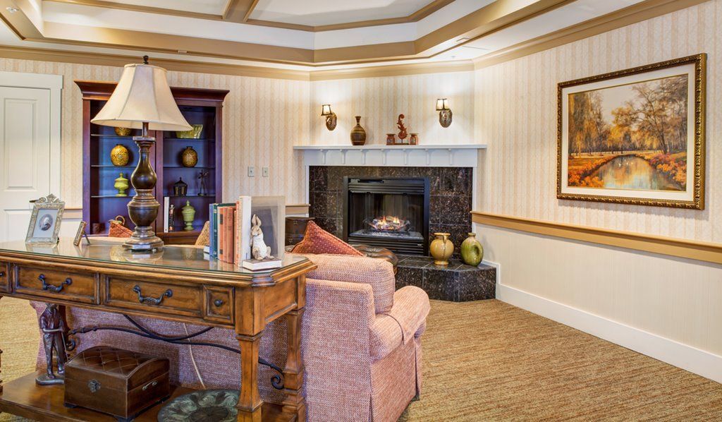 A cozy living room with a fireplace and elegant decor.
