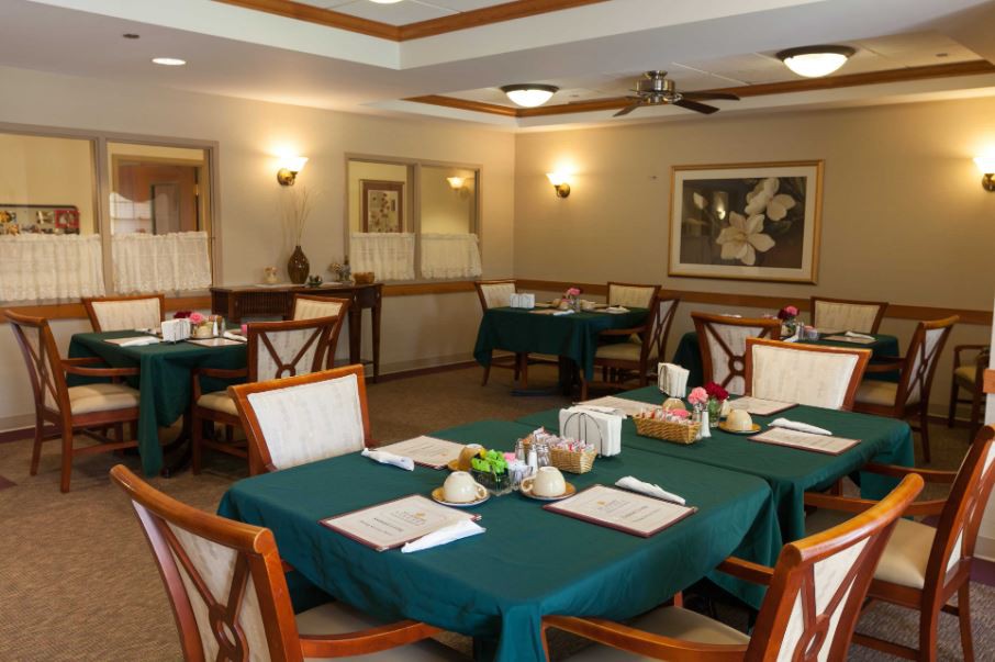 An elegant dining area with neatly arranged tables and chairs.
