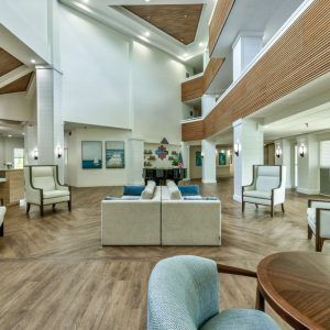 A modern and spacious lobby area with contemporary furniture and bright lighting.