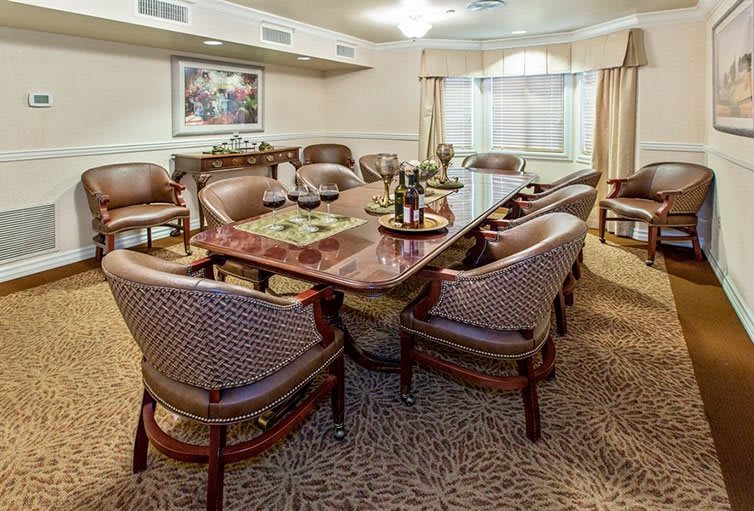 A well-appointed meeting room with a large conference table and comfortable chairs.