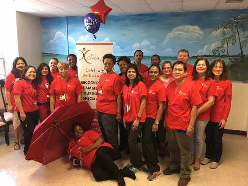 Team members gathered for a community event, showcasing camaraderie and enthusiasm.