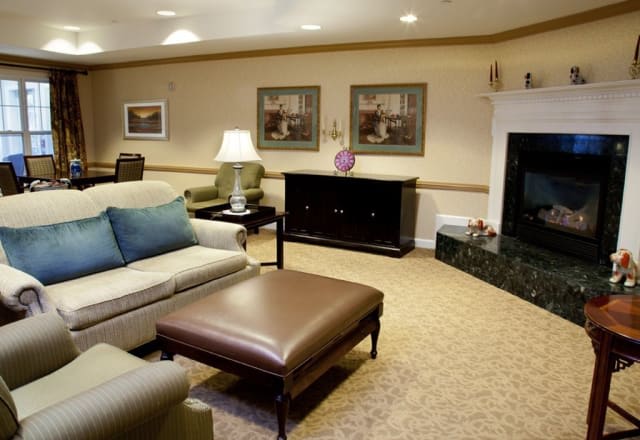 A cozy living room with comfortable seating and elegant decor.